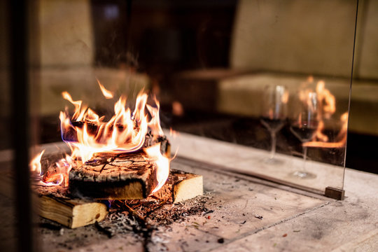 Close-up of wood burning at fireplace in house