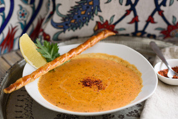 Turkish Red Lentil, Rice and Bulgur Soup Garnished with Lemon Wedge, Ezogelin Corbasi.