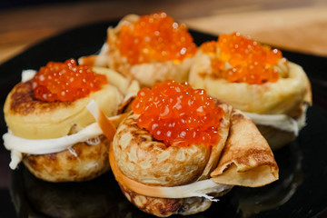 Obraz na płótnie Canvas Pancakes with red caviar. red caviar