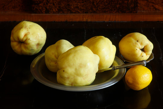 Still life with quinces and lemon