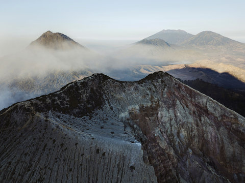 Indonesia, Java, Aerial view of smoke floating over mountains surrounding?Ijen?volcano