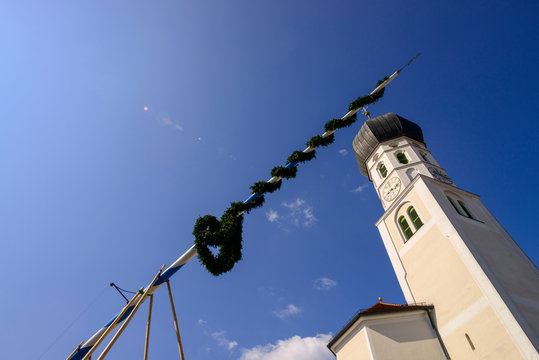 Low angle view of St. Benedikt church against blue sky during sunny day, Geretsried, Germany