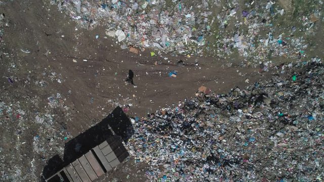 Aerial view of garbage truck at landfill, garbage disposal. Environmental pollution concept