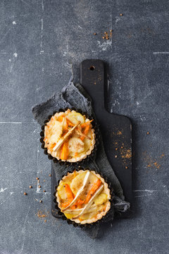 Directly above shot of hearty tartlets served on table