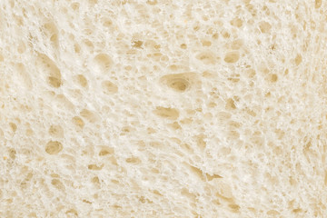 Sliced wheaten bread texture. Flat lay, top view, close-up