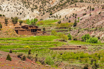 View of adobe village in the high snow-capped mountains in the Aït Bouguemez valley in Morocco © Nicolas VINCENT