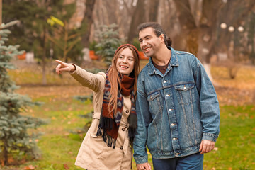 Fototapeta premium Happy couple walking in autumn park