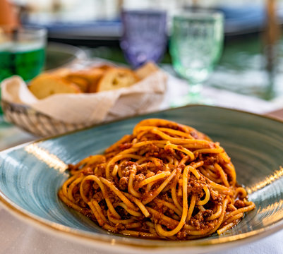 Pasta spaghetti bolognese in Venice, Italy at outside terrace restaurant on the grand canal. Tradidional italian food.