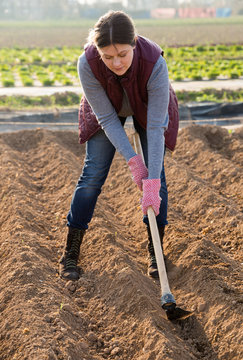 Woman working with hoe