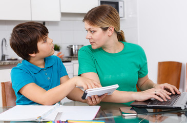 Displeased family doing homework