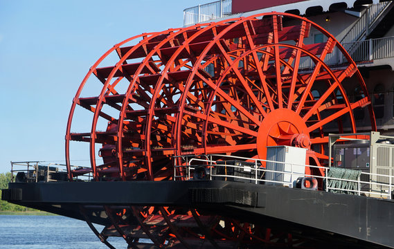 Close up of the large red paddle wheel of a classic large river Paddlewheel boat
