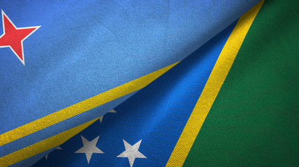 Aruba and Solomon Islands two flags textile cloth, fabric texture