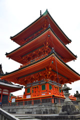 Kyoto, Japan - May 21 2017: Bright orange red shrine at the entrance of the Kiyomizu-dera temple