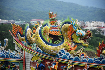 Yilan City, Taiwan - May 12 2017: Close up of a colorful dragon on an orange rooftop of a Taiwanese temple