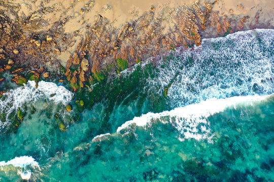 Waves rolling into the rocky coastline of Crystal Cove in Newport Beach 