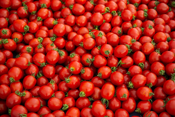 Red ripe tasty fresh delicious tomato vegetables in bazaar market