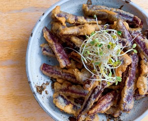 Tempura purple potatoes in a bowl