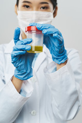 scientist in laboratory with test tubes