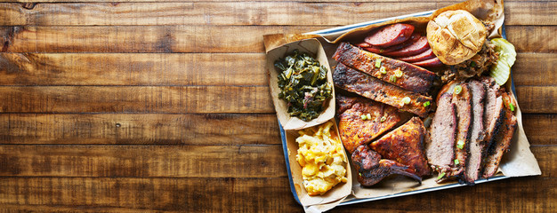 texas bbq platter on wooden table in copy space composition - obrazy, fototapety, plakaty