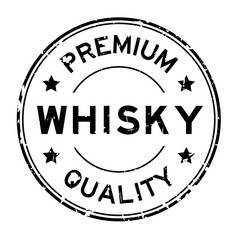 Grunge black premium quality whisky word round rubber seal stamp on white background