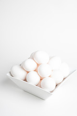 Fresh White Eggs Piled On White Square Bowl