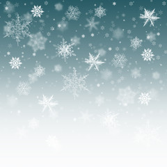 Snow background blue. Christmas snowfall with defocused flakes. Winter concept with falling snow. Holiday texture and white elements.
