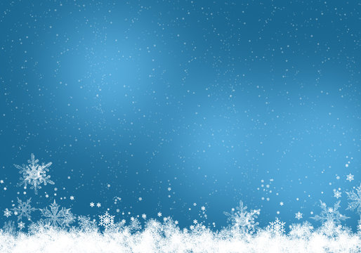 Snow background blue. Christmas snowfall with defocused flakes. Winter concept with falling snow. Holiday texture and white elements.