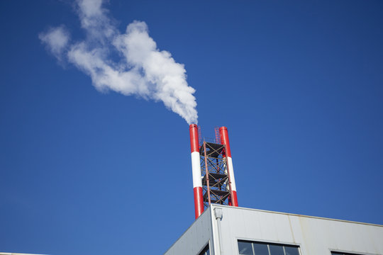 Heating plant - powerhouse and chimey with smoke
