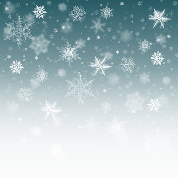 Snow background blue. Christmas snowfall with defocused flakes. Winter concept with falling snow. Holiday texture and white elements.