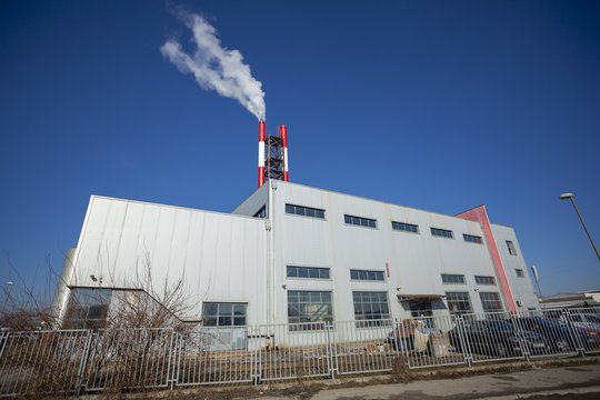 Heating plant - powerhouse and chimey with smoke
