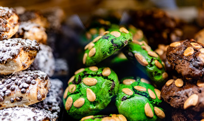 Pistachio dessert cakes with almonds in Venice, Italy. Traditional Italian food dolce al pistacchio.