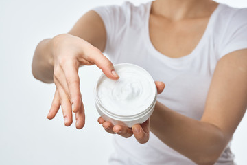 Woman with cream in her hands