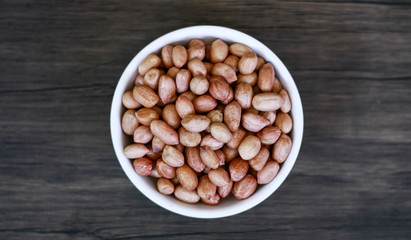 Peanuts or groundnut on wood background.