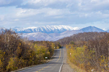 Landscape with a road on the background of mountains.