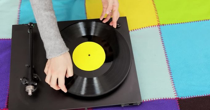 Top view on turntable with record. Playing music on turntable.
