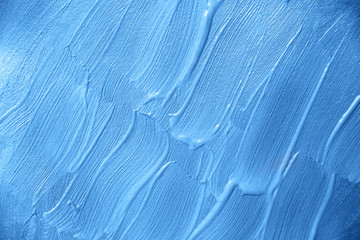 Classic blue color wall painted by brush abstact textured background.