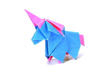 Cute Unicorn origami paper art isolated on white background. Ideas for DIY hobby (Do It Yourself) for Children.                                