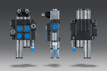 Two section Hydraulic distributor of the tractor on isolated grey background with shadow 