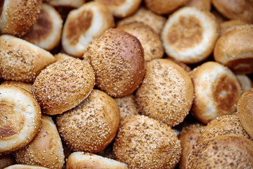 The soft toasted buns are in a box at the grocery store.