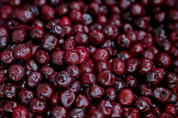 Frozen berries in grocery store shot close-up, blurred background.