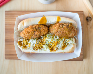 Japanese katsu pork sandwich. A fried lunch treat from Japan served with curry sauce.