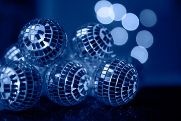 Classic Blue background, Close-up Crystal ball Decorated on Christmas night on a shiny background. Color of the Year 2020.