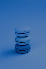 Classic macaroon in blue on a blue background