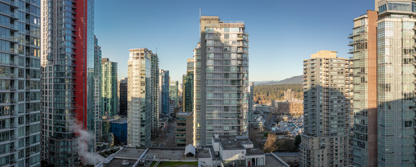 Panorama view or Vancouver city with huge glasses skyscrapers