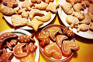 Gingerbread cookies, cookies with icing close up. Holiday treat. Art Christmas processing, grain on the photo.