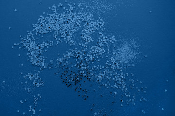 Classic blue color of year 2020. Festive elegant abstract background with bokeh lights and stars