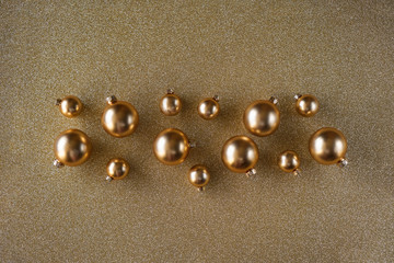 Christmas decoration beautifully scattered on a gold shiny background