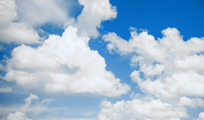 Obraz premium Beautiful vibrant blue sky with clouds background. Trend of 2020 year blue color