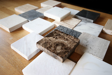 color samples of marble  on oak wood table, stone surface