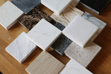 color samples of marble  on oak wood table, stone surface